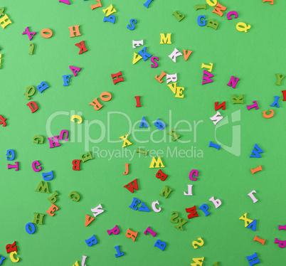 small wooden multi-colored letters of the English alphabet are s