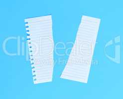 torn in half white blank sheet in line on blue background