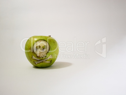 green apple with engraved skull, representative image of the use of gmo substances in food