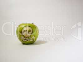 green apple with engraved skull, representative image of the use of gmo substances in food