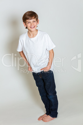 Young Happy Boy Smiling in Jeans and T-Shirt