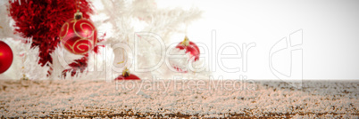 Composite image of wooden table covered with snow