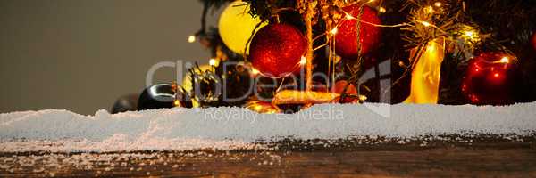 Composite image of wooden table with snow