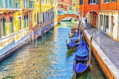 Venice gondolas in a narrow canal, no people