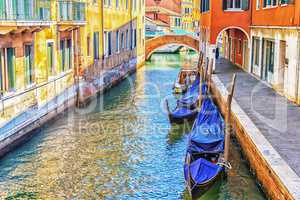 Venice gondolas in a narrow canal, no people