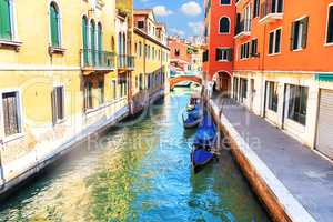 Quiet canal of Venice with gondolas and no tourists