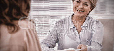 Doctor giving prescription to patient