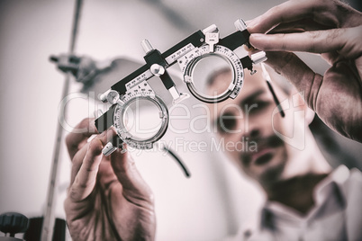 Close-up of optometrist holding messbrille