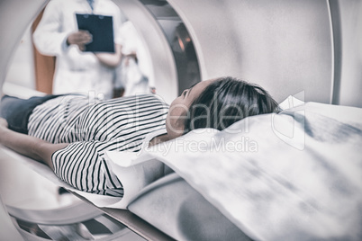 Female patient undergoing CT scan