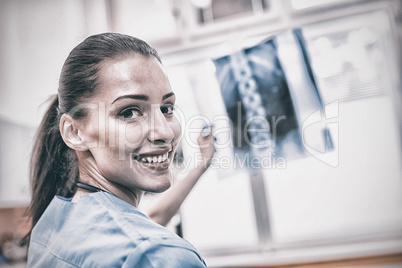 Portrait of nurse holding x-ray report Portrait of nurse holding x-ray report