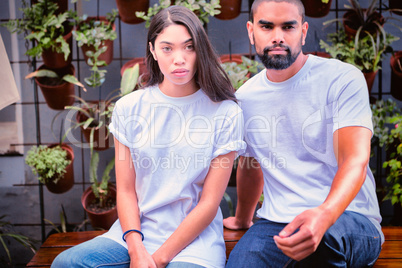 Hipster couple with blank t-shirts for your design
