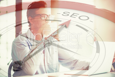 Composite image of compass pointing to seo