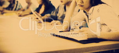 Woman sitting in meeting room with her colleagues