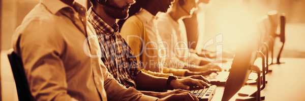 Team of colleagues working at their desk with headset