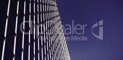 Low angle view of office building against blue sky