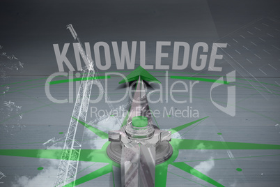 Composite image of compass with knowledge text