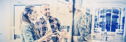 Businesswoman discussing with colleagues in office