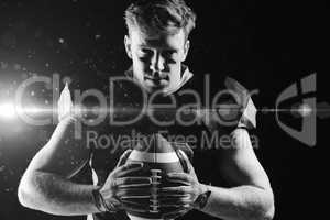 American football player holding rugby