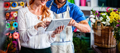 Couple using digital tablet