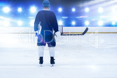 Composite image of ice hockey player on the ice