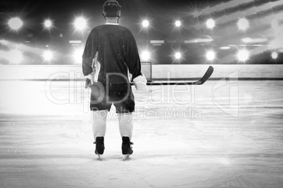 Composite image of ice hockey player on the ice