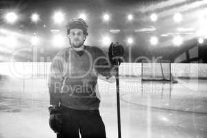 Composite image of portrait of ice hockey player at rink