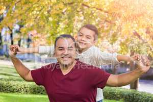 Mixed Race Hispanic and Caucasian Son and Father Having Fun