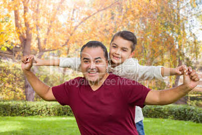 Mixed Race Hispanic and Caucasian Son and Father Having Fun