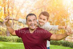 Mixed Race Hispanic and Caucasian Son and Father Having Fun