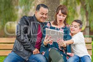 Caucasian Mother and Hispanic Father Using Computer Tablet