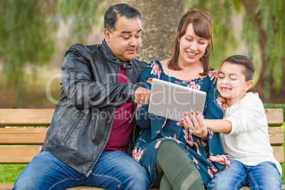 Caucasian Mother and Hispanic Father Using Computer Tablet