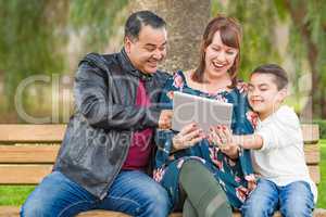 Caucasian Mother and Hispanic Father Using Computer Tablet