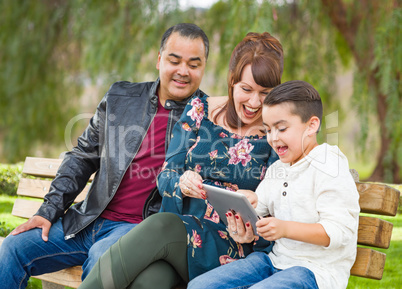 Caucasian Mother and Hispanic Father Using Computer Tablet