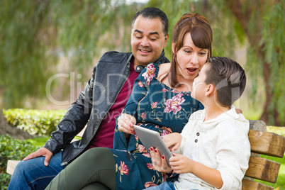 Caucasian Mother and Hispanic Father Using Computer Tablet