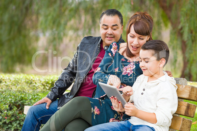 Caucasian Mother and Hispanic Father Using Computer Tablet