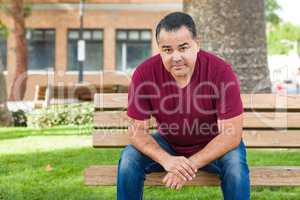 Mixed Race Man on a Park Bench.