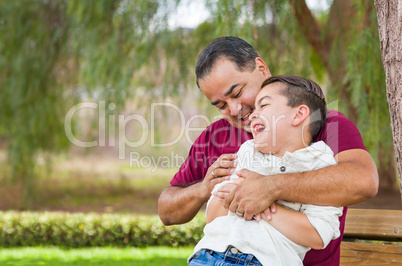 Mixed Race Hispanic Father Tickling His Caucasian Son