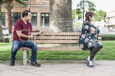 Unhappy Mixed Race Couple Sitting Facing Away From Each Other