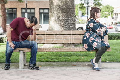 Arguing Mixed Race Couple Sitting Facing Away From Each Other