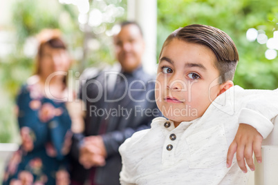 Mixed Race Couple Standing Behind Young Son