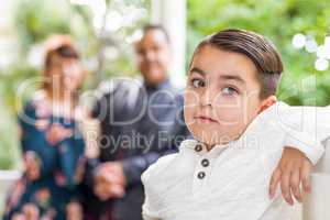 Mixed Race Couple Standing Behind Young Son