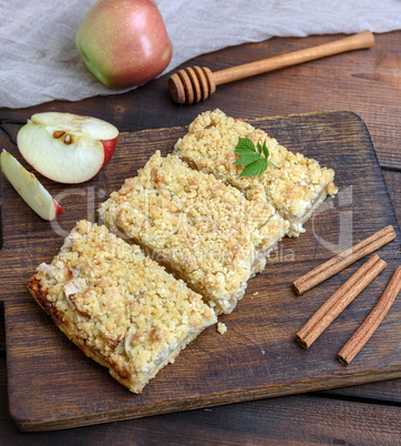 slices of apple crumble cake on brown wooden board