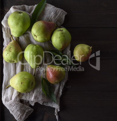 green pears on a brown wooden table