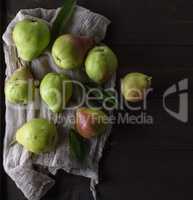 green pears on a brown wooden table
