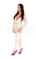 Pretty woman standing in a silver body suit