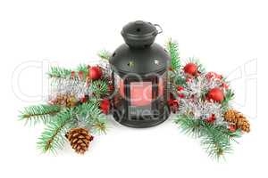 Bright ornaments, hand lantern and spruce branches isolated on w