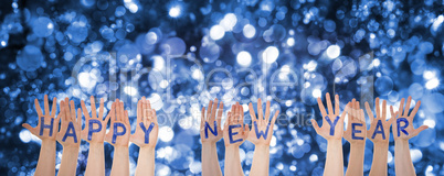 Hands Building Word Happy New Year, Glittering And Sparkling Bokeh Background