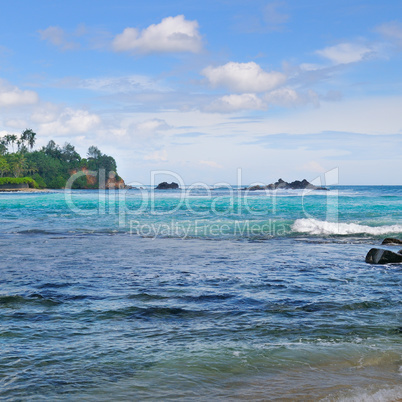 Ocean, picturesque beach and blue sky.