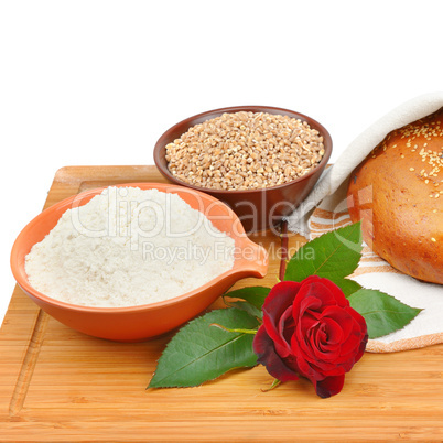 Bread, whole grain and flour isolated on white background.