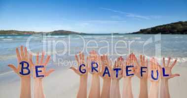 Many Hands Building Word Be Grateful, Beach And Ocean